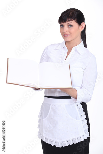 Photo: Waitress holding menu Waitress holding menu