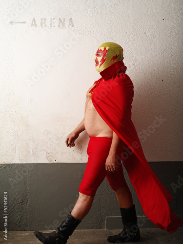 Photo: Luchador walking towards arena Luchador walking towards arena