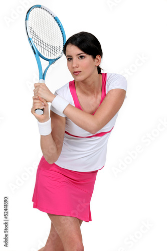 Photo: woman playing tennis woman playing tennis