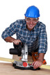 Photo: craftsman working with an electric saw craftsman working with an electric saw