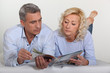 Photo: Mature couple lying in bed Mature couple lying in bed