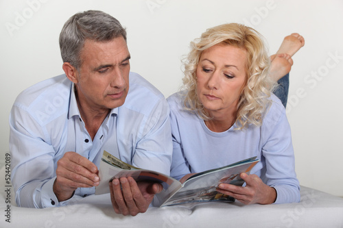 Photo: Mature couple lying in bed Mature couple lying in bed