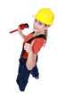 Tradeswoman giving the thumb's up and holding a pipe wrench