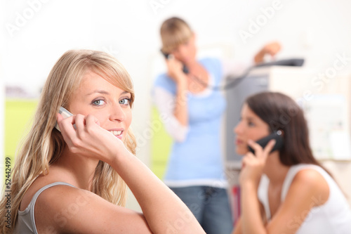 Photo: Group of girls on the phone Group of girls on the phone