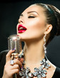Foto: Singing Woman with Retro Microphone Singing Woman with Retro Microphone