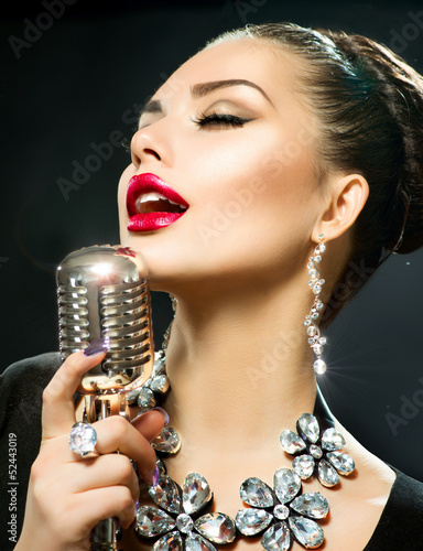 Photo: Singing Woman with Retro Microphone Singing Woman with Retro Microphone
