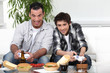 Father and son playing games together