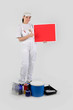 Foto: woman painter holding red panel for message woman painter holding red panel for message