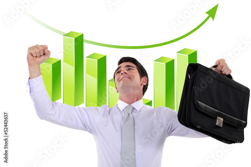Photo: Businessman in front of chart Businessman in front of chart