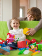 Happy mother plays with child