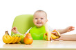 Photo: mother spoon feeding baby girl mother spoon feeding baby girl
