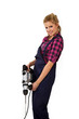 Junge Handwerkerin sexy mit Schlagbohrer 