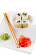 sushi on ceramic plate isolated on white