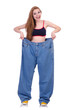 Woman in dieting concept with big jeans