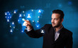 Photo: Attractive businessman choosing from social network map Attractive businessman choosing from social network map