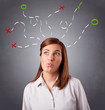 Young woman thinking with abstract marks overhead