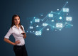 Photo: Young lady holding a phone with arrows and message icons Young lady holding a phone with arrows and message icons