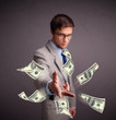 Young man throwing money