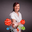 Young woman throwing dices and chips