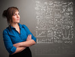 Pretty woman looking at stock market graphs and symbols