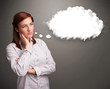 Photo: Pretty lady thinking about cloud speech or thought bubble with c Pretty lady thinking about cloud speech or thought bubble with c