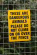 warning sign on fence