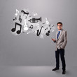 attractive young man singing and listening to music with musical