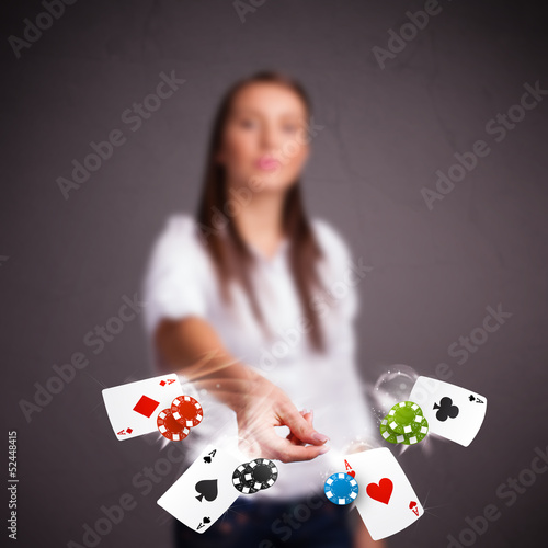 Photo: Young woman playing with poker cards and chips Young woman playing with poker cards and chips
