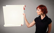 Young woman holding white origami paper copy space