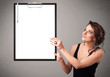 Photo: Young girl holding black folder with white sheet copy space Young girl holding black folder with white sheet copy space