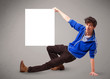 Young boy presenting white paper copy space