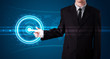 Businessman pressing high tech type of modern buttons
