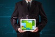 Businessman holding a tablet with modern software operational sy