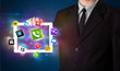Businessman holding a tablet with modern colorful apps and icons