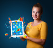 woman holding modern tablet with colorful diagrams and graphs