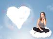 Photo: Beautiful lovely woman sitting on cloud with heart Beautiful lovely woman sitting on cloud with heart