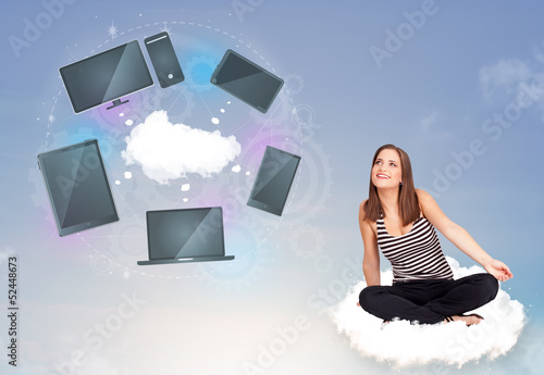Photo: Young girl sitting on cloud enjoying cloud network service Young girl sitting on cloud enjoying cloud network service