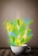 Photo: Tea cup with leaves and colorful abstract lights Tea cup with leaves and colorful abstract lights