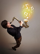 Photo: Handsome musician playing on saxophone with musical notes Handsome musician playing on saxophone with musical notes