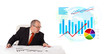 Businessman sitting at desk with statistics