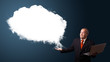 Businessman holding a laptop and presenting abstract cloud copy
