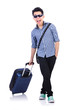 Young guy with travel case on white