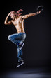 Dancer dancing in the dark studio
