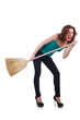 Young woman with broom isolated on white