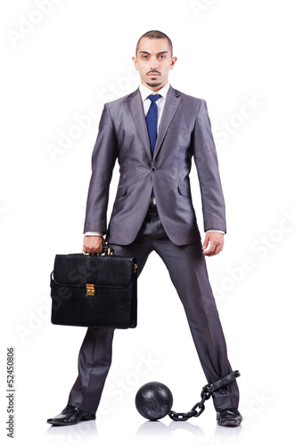 Photo: Businessman with shackles on white Businessman with shackles on white