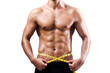Muscular man measuring his muscles