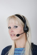 Foto: Portrait of young woman with headset Portrait of young woman with headset