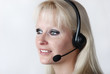 Foto: Portrait of young woman with headset Portrait of young woman with headset
