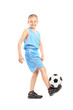 Photo: Full length portrait of a child playing with a soccer ball Full length portrait of a child playing with a soccer ball