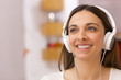 Young woman listening to music at home